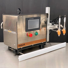 Load image into Gallery viewer, Front side of the FG-200 bottle filling machine with two N100-R nozzles on a stainless steel table